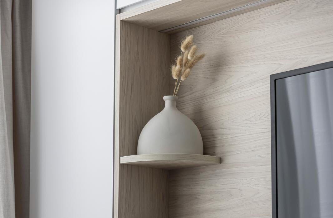 Curved floating shelf set into a whitewashed oak niche, joinery interior by Porterbox Studio