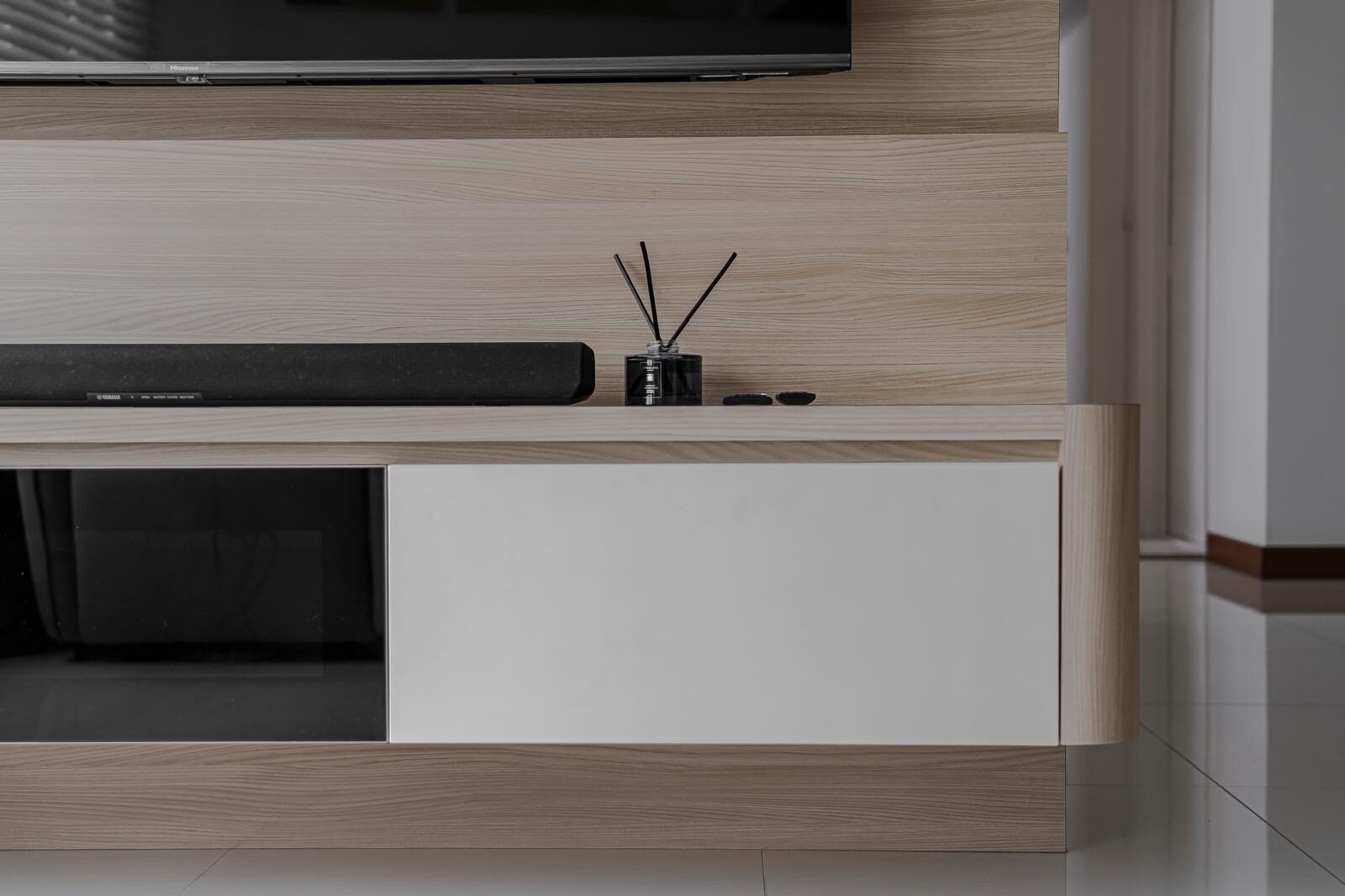Floating oak console with matt white drawers and a rounded return, living interior by Porterbox Studio