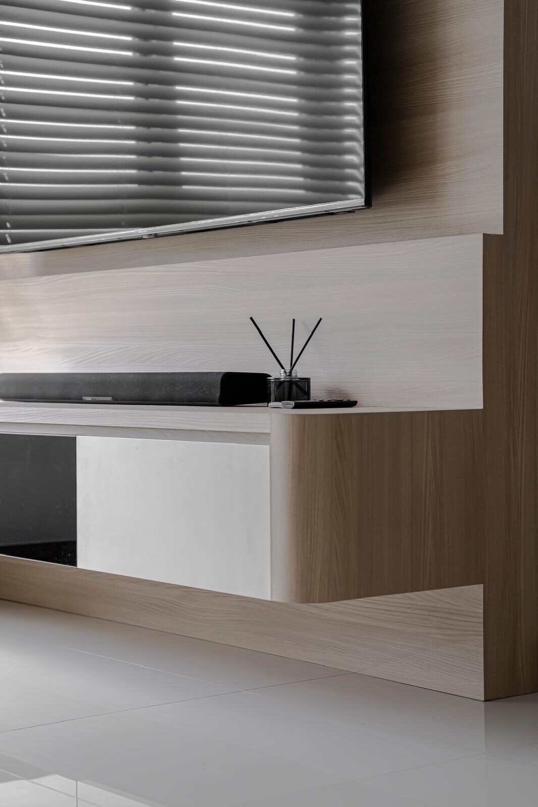 Layered oak panelling and a stepped console profile, living interior by Porterbox Studio